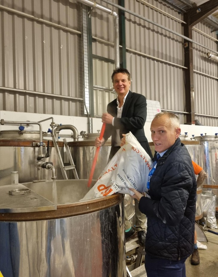Peter Cooper, Executive Principal, and Phil Tranter, Deputy Principal of Hereford Sixth Form College, do the mashing at Wye Valley Brewery.