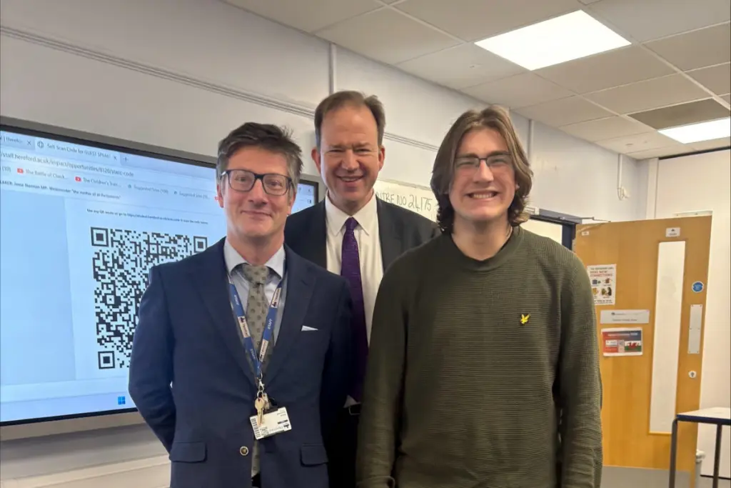 Enrichment lead Marco Martinelli with MP Jesse Norman and student Cameron PK.